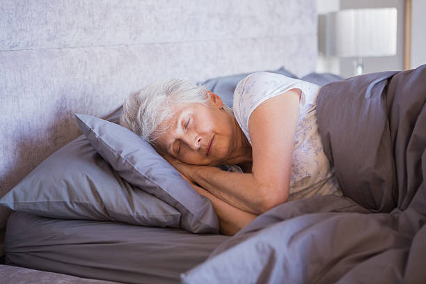 istock Mature woman sleeping in her bedroom 463409531