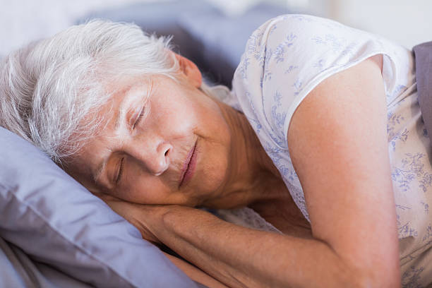 istock Mature woman sleeping in her bed 463409627