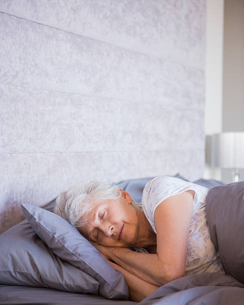 istock Retired woman sleeping in her bedroom 463409661