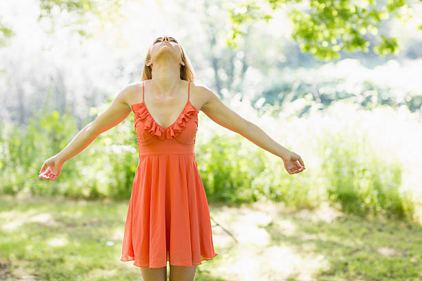 istock Pretty blonde stretching her arms in a park 463410939
