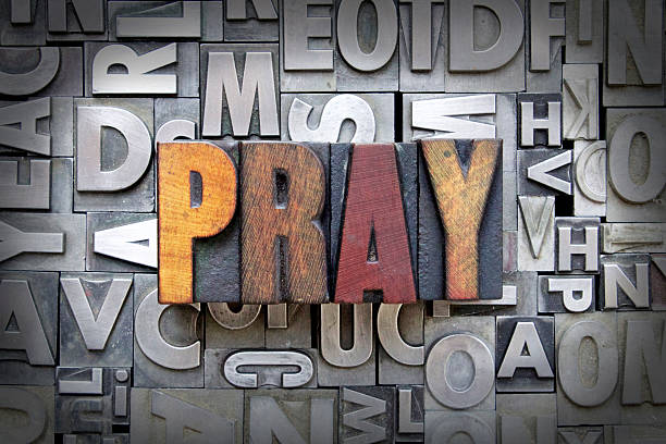 pregare - praying religion spirituality letterpress foto e immagini stock