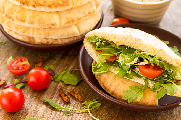 istock Pita with tomatos, cheese and salad mix 463423543