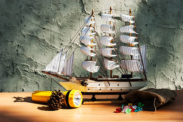 istock wooden sail ship toy model with torch 463424453