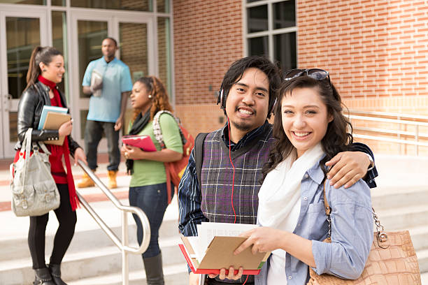 istock Education: Multi-ethnic college friends hang out before class. 463425873