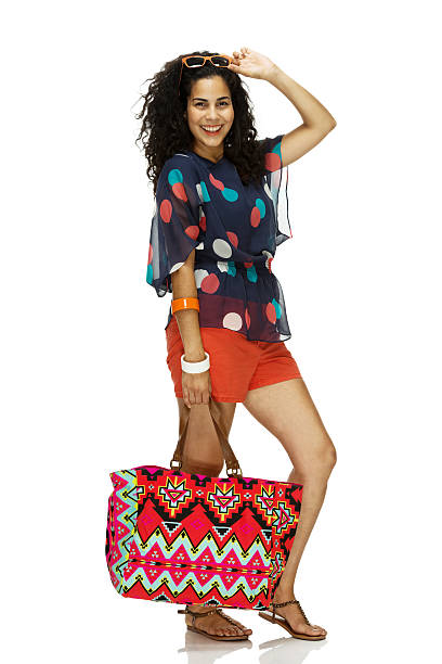 istock Smiling girl holding a handbag 463426057