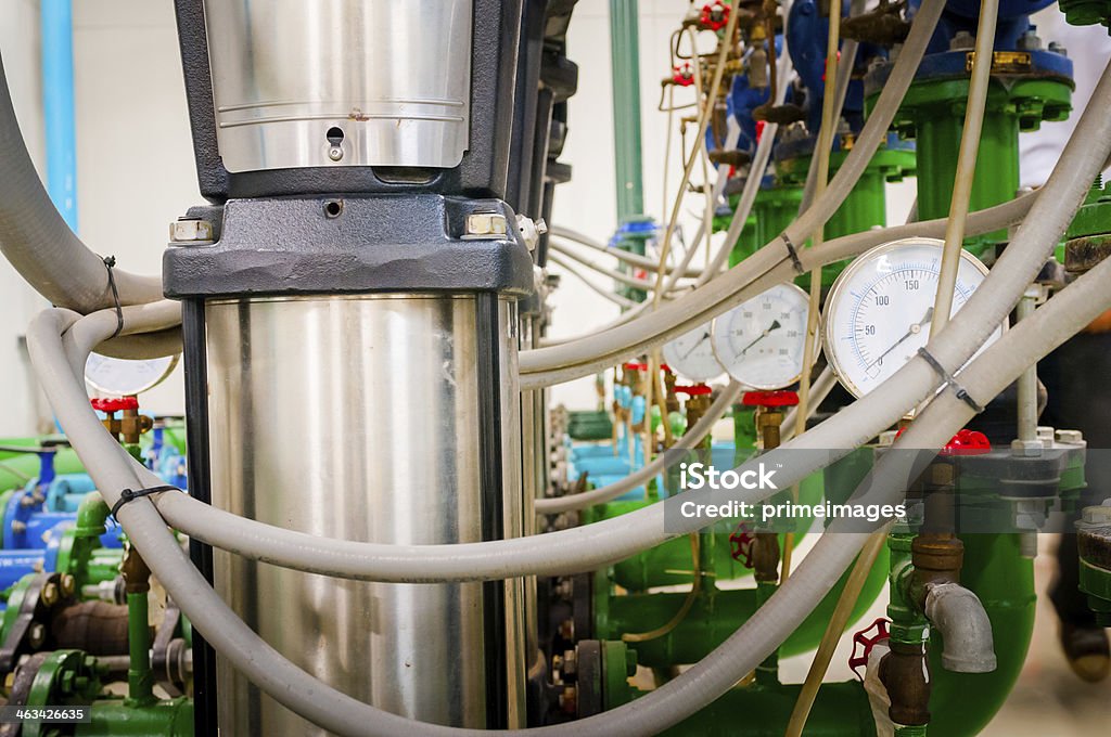 Water pumping station and industrial interior pipes Water pumping station and industrial interior pipes in highrise building office . Factory Stock Photo