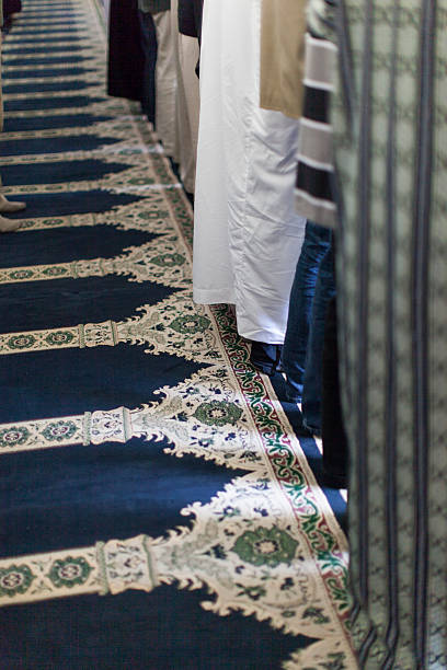 istock Muslim men standing on a beautiful carpet 463428109