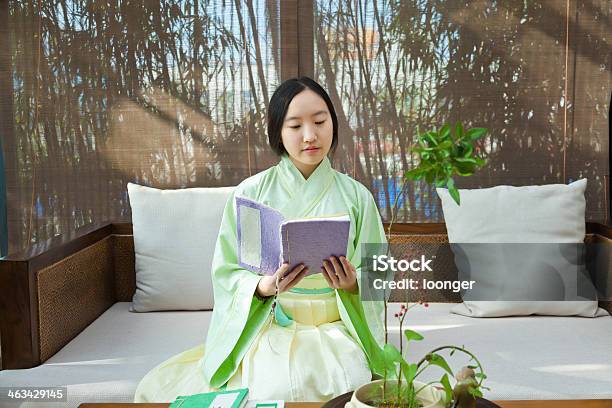 Chinese Girl Reading The Old Book Stock Photo - Download Image Now - 16-17 Years, Adult, Ancient