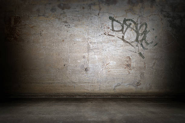 Grunge wall interior with graffiti tag stock photo