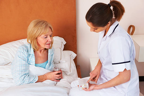 istock Nurse explaining medication to a senior female patient 463440065