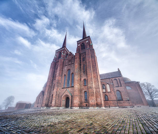 Roskilde Cathedral on a foggy day stock photo