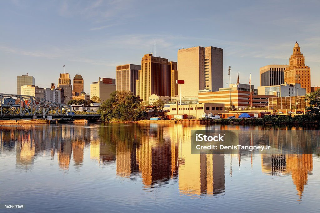 Newark New Jersey Downtown Newark skyline refection on the banks of the Passaic River. Newark is the largest city in New Jersey. Newark is one of largest rail and air hubs in the nation. Newark is known for its glamorous performing arts venues, premium outlet mall, museums, and the argest collection of cherry blossoms. Newark - New Jersey Stock Photo