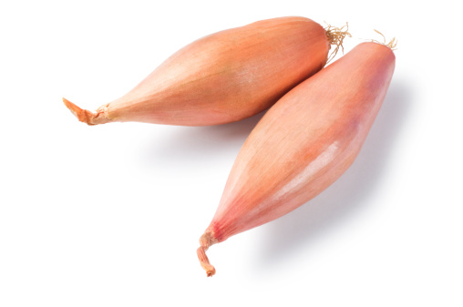 Pair of shallots isolated on white.