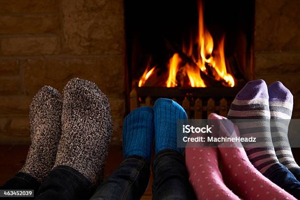 Family Warming Feet By Fire Stock Photo - Download Image Now - Family, Fireplace, Sock