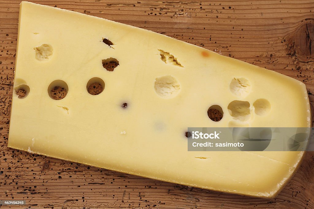 Big Emmental Cheese (Emmentaler) Big Emmental Cheese (Emmentaler) from Switzerland on a wooden board Cheese Stock Photo