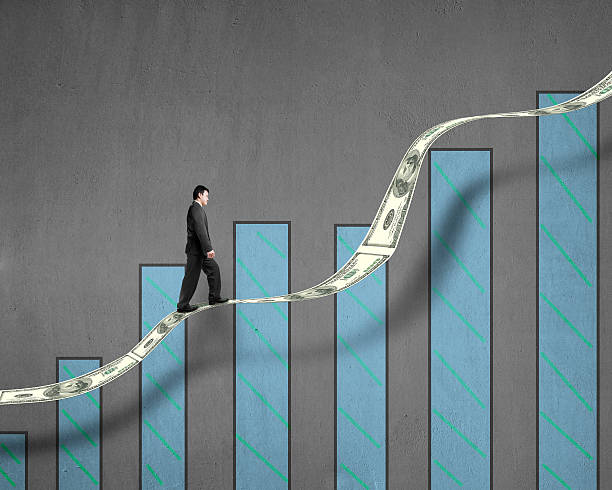 istock Businessman walking on growth money trend with chart 463460439