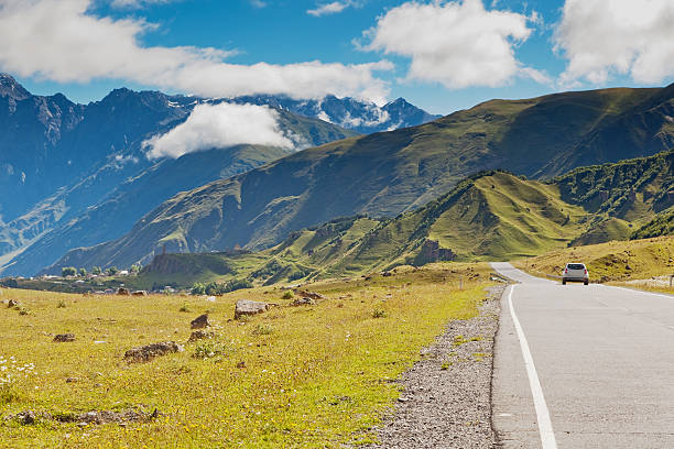 istock white car on the road 463462231