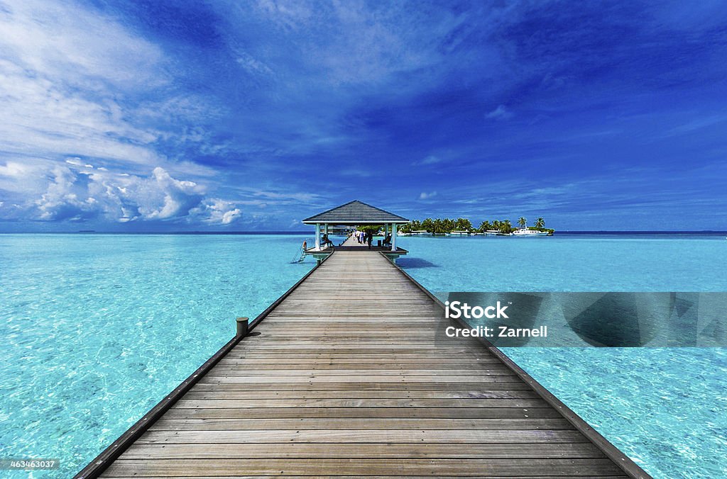 Boardwalk to paradise A boardwalk leads to an island in the Maldives Maldives Stock Photo