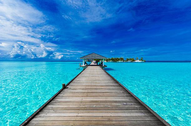 Boardwalk to paradise A boardwalk leads to an island in the Maldives maldivian culture stock pictures, royalty-free photos & images