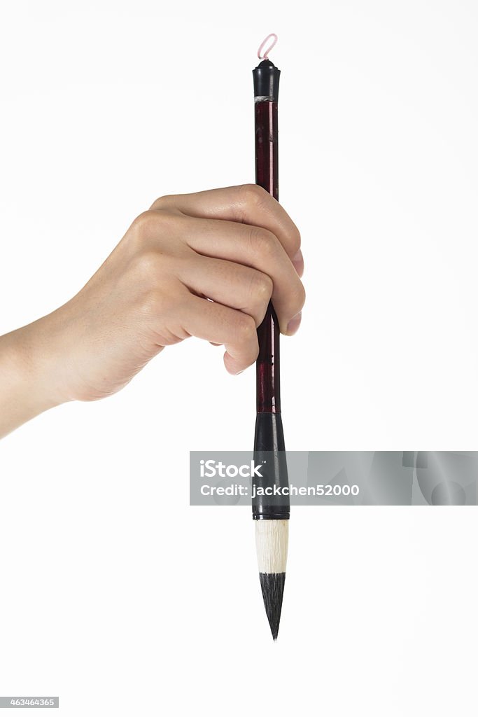 writing brush in man's hand Hairbrush Stock Photo