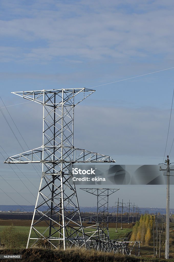 Power poles Power poles, standing in a field Agriculture Stock Photo