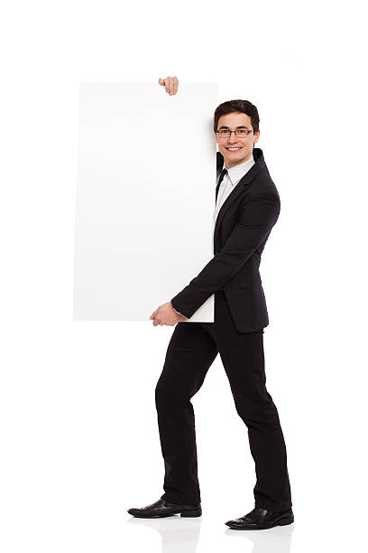 istock Cheerful male office worker standing with placard. 463470587