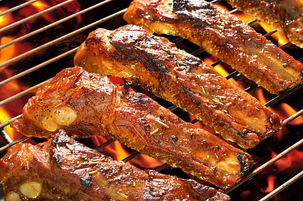 istock Grilled ribs on a bar-b-cue seasoned and marinated 463474705