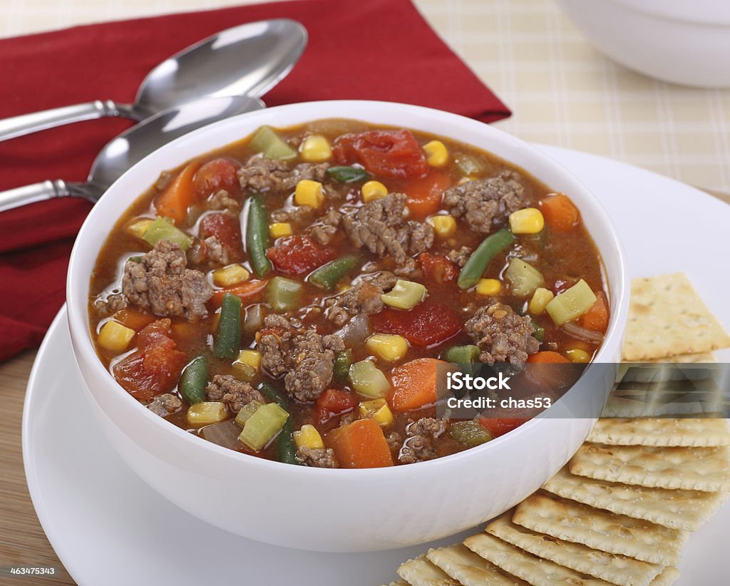 Vegetable Soup Bowl of vegetable and beef soup with crackers Hamburger Stock Photo