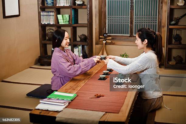 Two East Asian Girl Showing Tea Ceremony Stock Photo - Download Image Now - 16-17 Years, 20-29 Years, Adult
