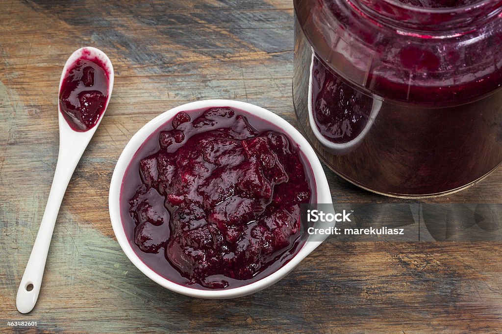 sugar free cranberry sauce sugar free cranberry sauce with addition of blueberry, apples and honey - small bowl, jar and spoon Blueberry Stock Photo