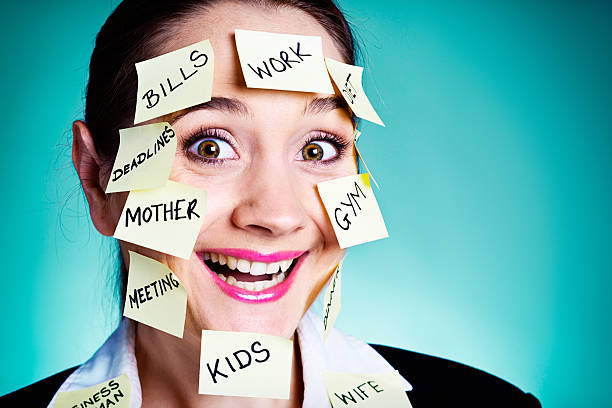 istock I can cope! Multitasking woman with sticky-label reminders smiles 463483553