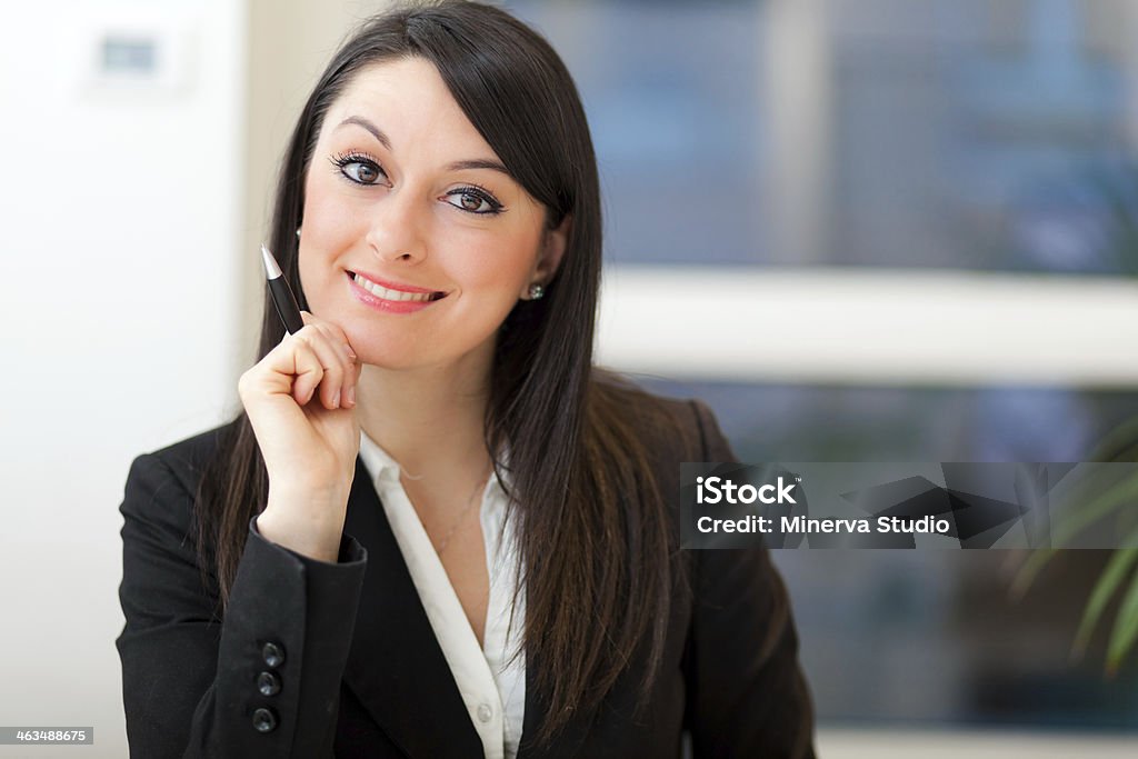Businesswoman in her office Adult Stock Photo