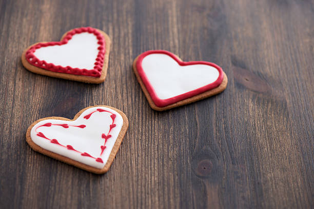 istock Heart shaped ginger cookies on wooden background 463494649