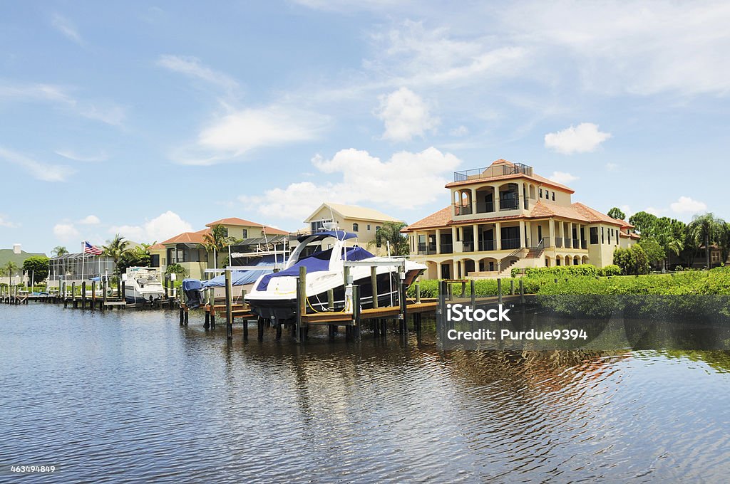 Luxury Waterfront Homes and Boats on Punta Rassa Cove Florida RAW source image processed with Nikon Capture NX version 1.2 Pier Stock Photo