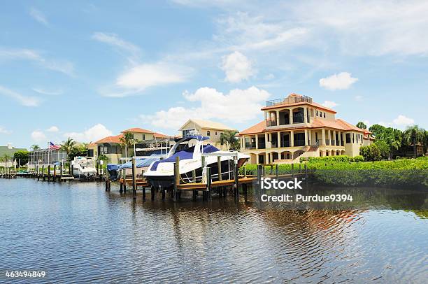 Luxury Waterfront Homes And Boats On Punta Rassa Cove Florida Stock Photo - Download Image Now