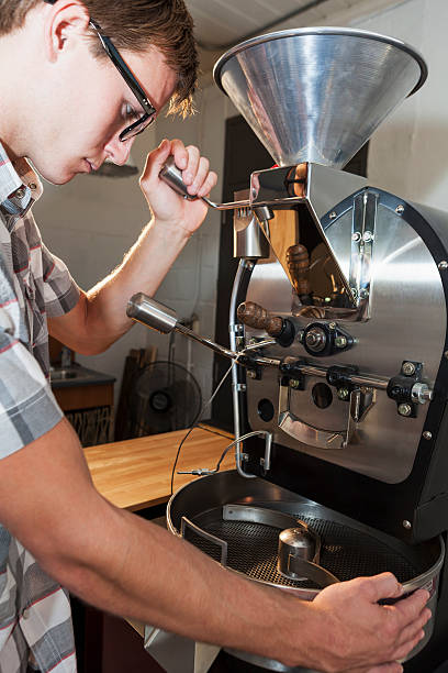 istock Man working in coffee shop with roaster 463496595