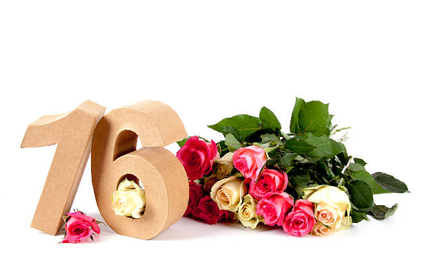 Age in numbers on a bed of roses stock photo