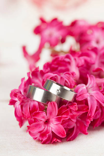 istock Wedding rings on red hyacinth 463511033