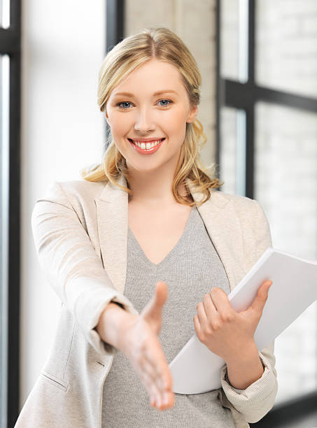 istock woman with an open hand ready for handshake 463513387