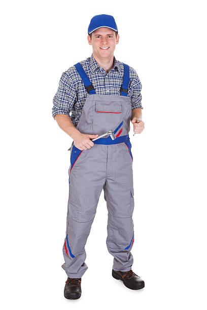 istock Happy male mechanic holding ratchet 463514295