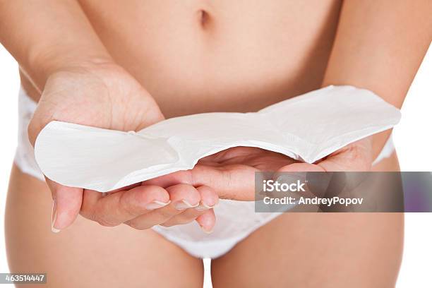 Woman Holding Sanitary Pad Stock Photo - Download Image Now - Menstruation, Panties, Women