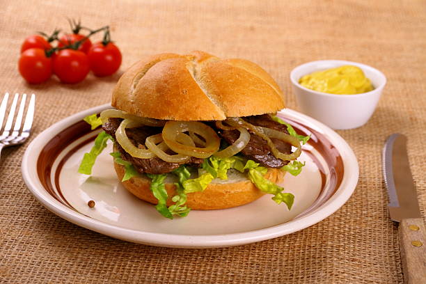 istock Ochsensemmel, grilled beef with onion rings in bread rolls 463517909