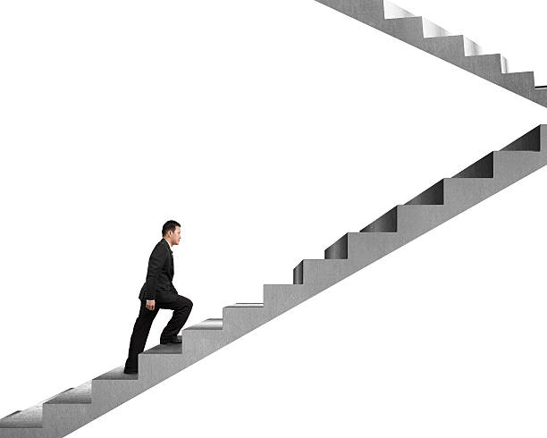 istock Businessman climbing on concrete stairs 463517921