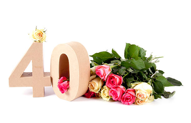 Age in numbers on a bed of roses stock photo
