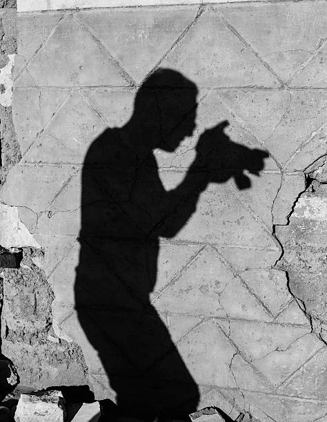 istock Shadow of a photographer on wall 463537605