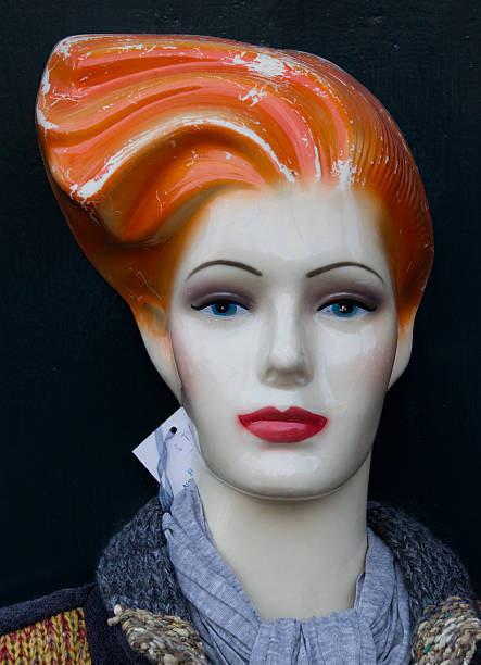 istock Mannequin with red lips and orange hair 463537909