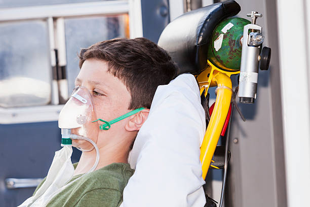Boy on ambulance stretcher