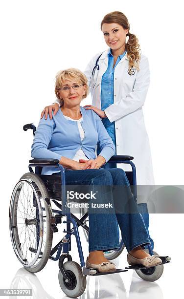 Senior Woman In Wheelchair With Doctor Stock Photo - Download Image Now - Cut Out, Doctor, Wheelchair