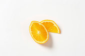 Sliced oranges on white background