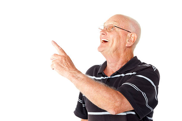 istock Excited senior man pointing at copyspace 463541289